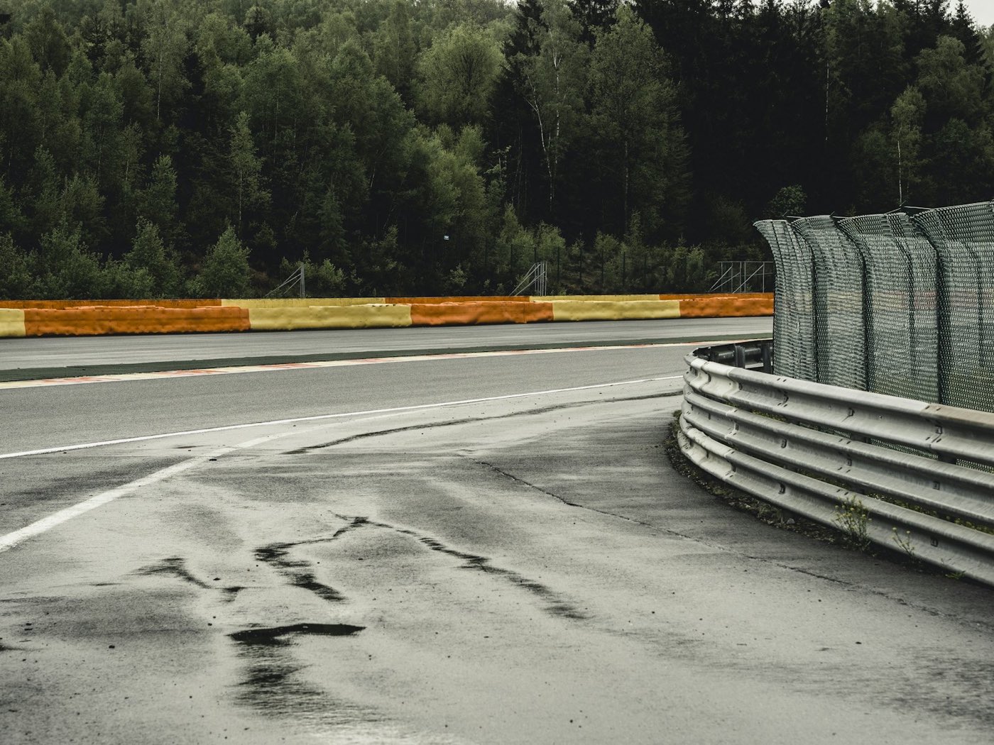 A racing circuit corner, kerbs and safety barriers — illustrative archive photograph